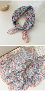 Detailed view of floral cotton linen neckerchief with purple scalloped wavy edges