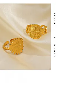 Detailed view of 18K gold plated octagram star rings on smooth satin background