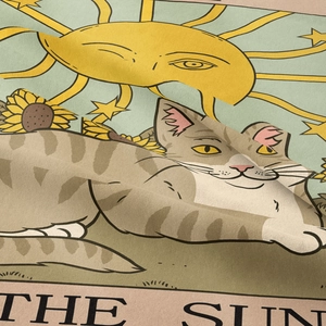 Close-up of woven sun tarot tapestry with a tabby cat and detailed sunflower texture