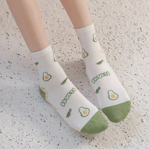 Women's cotton crew socks featuring cute green avocado pattern with white base