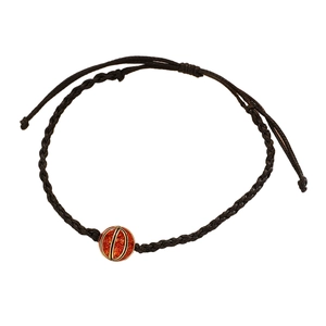Detailed view of brown braided adjustable bracelet with orange basketball charm pendant
