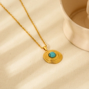 Vintage gold plated necklace with blue turquoise stone pendant and spiral texture design
