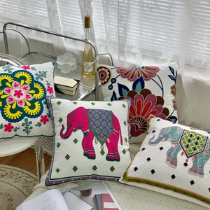 Pastoral floral and ethnic elephant embroidered throw pillow cover detail shot for home decor.