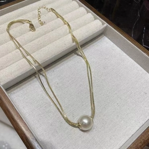 Double-layered titanium steel necklace with gold snake chain and large pearl pendant
