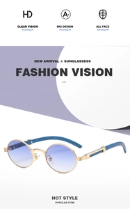 Detail of round vintage sunglasses with gold metal frame and blue wood grain temples