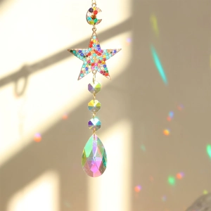 Detailed view of crescent moon and star suncatcher with colorful crystals and rainbow prisms