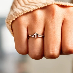 Elegant s925 sterling silver cross ring with cubic zirconia stones on female hand