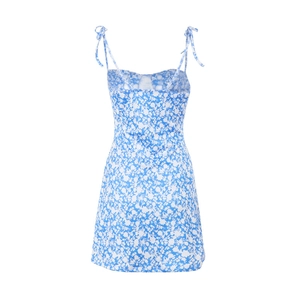 Detail of blue and white floral dress showing slim shoulder straps and tie-up design