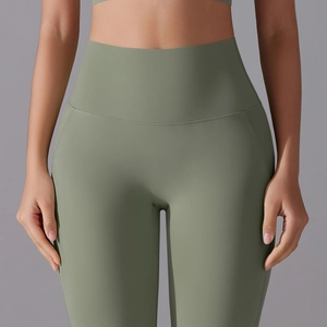 Detailed view of high-waist sage green yoga pants featuring smooth seamless tummy control