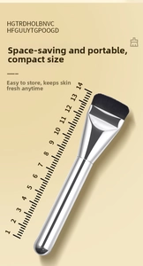 Detail of 14cm portable flat head foundation brush with silver metal handle and black bristles