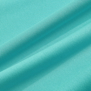 Macro shot of teal quick-dry polo shirt fabric showing breathable mesh texture
