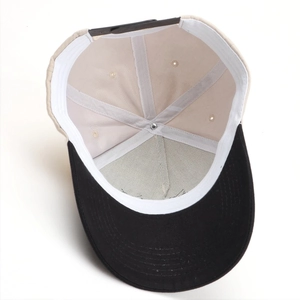 Detail view of the baseball cap's inner structure with adjustable plastic snap closure