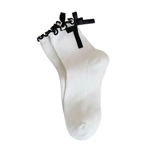 Japanese style white mid-calf socks with black bow ties and ruffled edges for girls