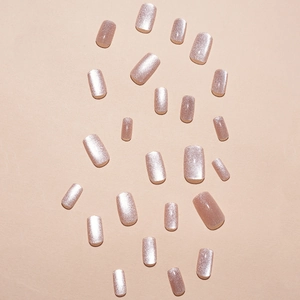 Pink cat eye press-on nails with shimmering gradient effect and translucent finish