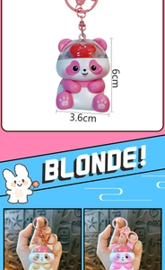 Detailed display of cute glowing panda keychain showing 6cm dimensions and color variants.