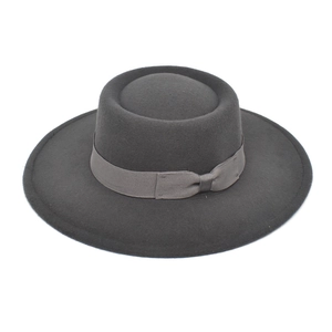 Detailed view of the dark gray wool felt bolero hat with matching ribbon and bow accent