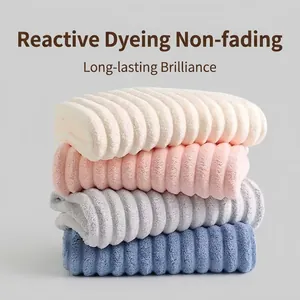 Set of four striped coral fleece towels in cream pink grey and blue colors