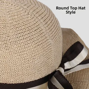 Close-up of beige woven straw hat crown featuring a striped bow ribbon decoration