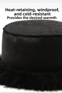 Detail view of black faux fur lining and plush suede texture on thermal winter hat