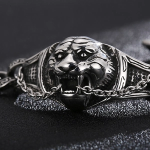 Macro shot of silver tiger head bracelet with intricate vintage stainless steel textures