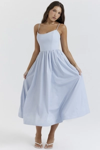 Close-up of light blue backless midi dress with fine spaghetti straps and cotton texture