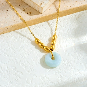 Detail of 18K gold-plated chain with lucky beads and green jade-style donut pendant