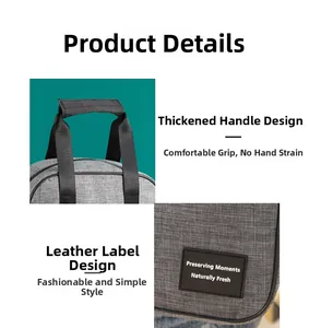 Detail of reinforced handles and premium leather label on a gray cation insulated lunch bag