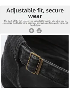 Detail of vintage bronze metal buckle and adjustable fabric strap on a flat top army cap