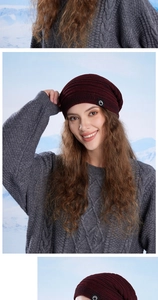 Close-up of wine red knit beanie featuring a fleece lining and circular side brand logo