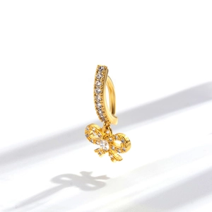 Elegant gold navel ring with sparkling cubic zirconia and a crystal bow pendant