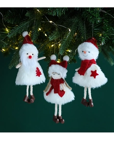Plush Santa and snowman ornaments hanging on a Christmas tree with warm festive lighting