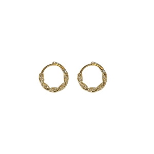 Elegant gold twisted rope hoop earrings with pavé zircon stones on white background
