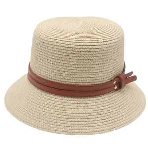Straw cloche sun hat in cream white featuring brown leather belts and metal buckle bow