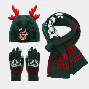 Flat lay of green Christmas reindeer beanie hat, scarf, and touch gloves 3-piece set