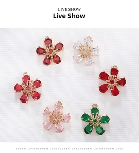 Macro shot of 6 color-pendant flower charms with micro-pave cubic zirconia and gold settings