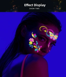 Macro detail of glowing neon butterfly and floral facial temporary tattoo on model's face