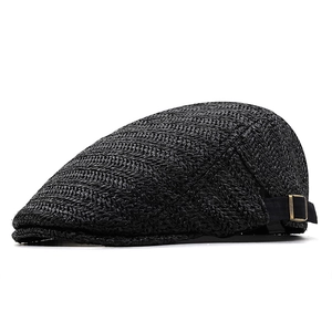 Minimalist black woven flat top ivy cap with vintage metal buckle and wavy texture