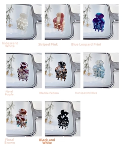 Detailed grid of mini acetate hair claws in various patterns like leopard and floral prints