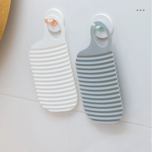 Portable wave texture washboard in white and gray with suction hooks for wall hanging