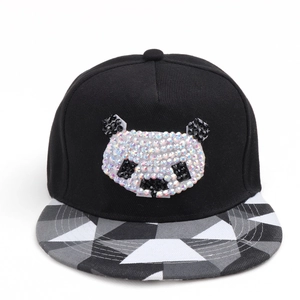 Detail of cartoon panda rhinestone pattern and geometric patchwork on black hip hop cap
