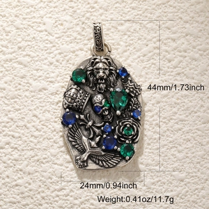 Pendentif crâne rétro argenté avec gemmes bleues et dimensions 44mm x 24mm