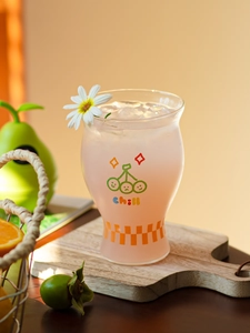 Detail of high borosilicate glass with green smiley and orange chill text pattern