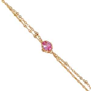 Elegant double-layered gold bracelet with pink oval gemstone and small decorative beads