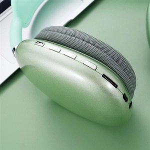 Detail of green headset featuring metallic finish earcups and grey fabric cushions