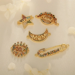 Five-piece gold MOM pendant set with stars, moon and eye charms featuring colorful crystals