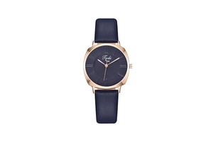 Detail of square rose gold watch case with navy blue leather strap and minimalist dial