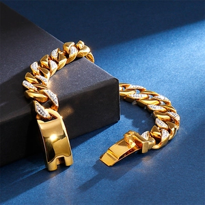 Detailed close-up of 18K gold-plated Cuban link bracelet with sparkling zircons on black box