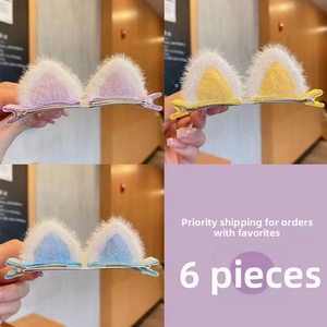 Detail of 6 piece plush cat ear hair clips in vibrant purple, yellow and blue colors