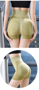 Detail of high waist seamless yoga shorts in green marl with push-up scrunch and mesh