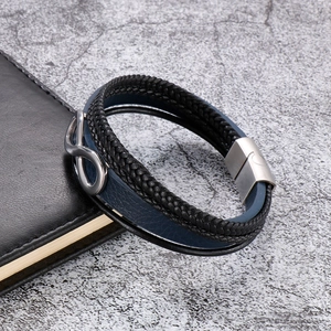 Detail of multi-layer braided leather bracelet with infinity symbol and magnetic clasp